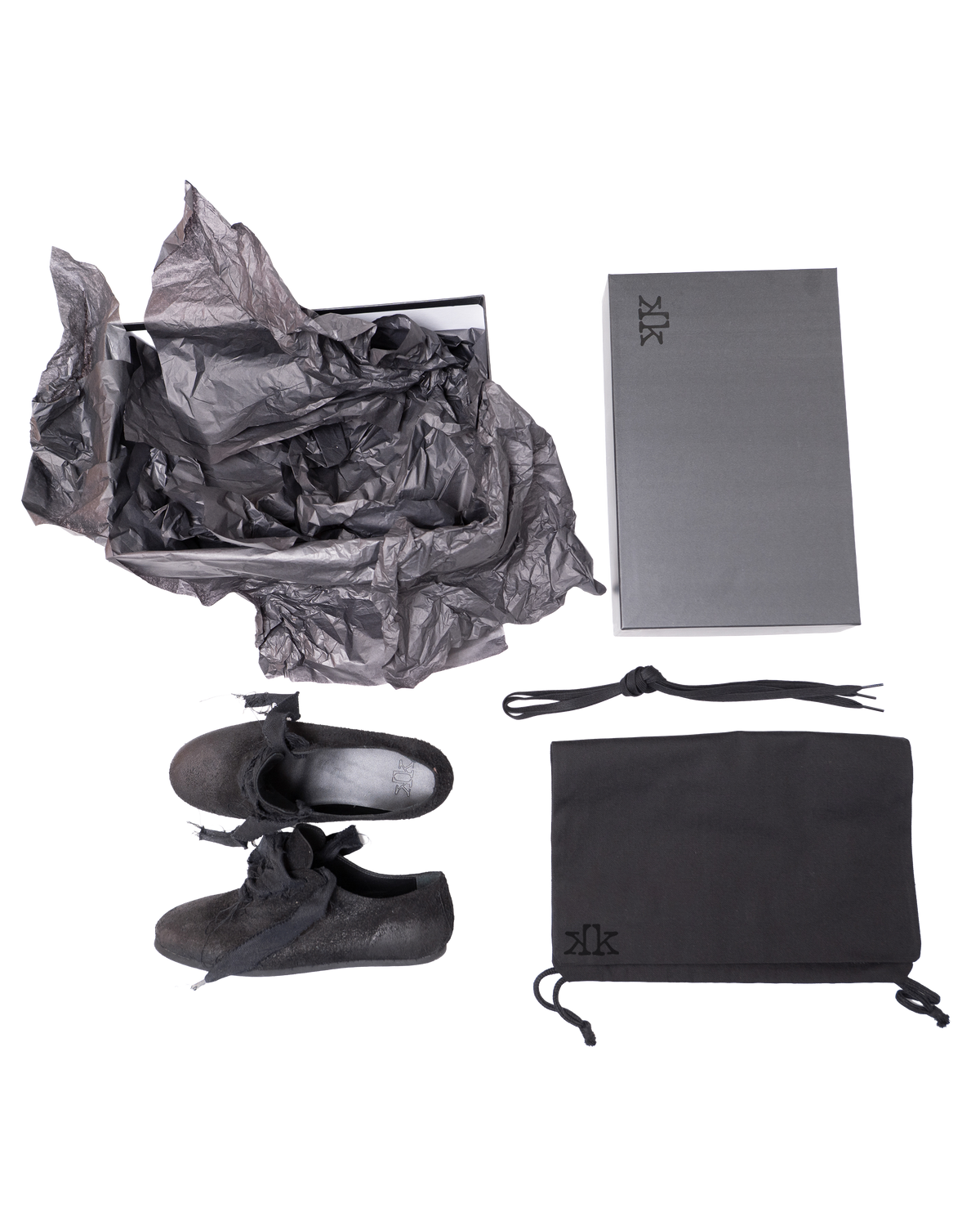 K-Two Studios Sash Flats black shoes displayed with packaging, dust bag, and accessories.